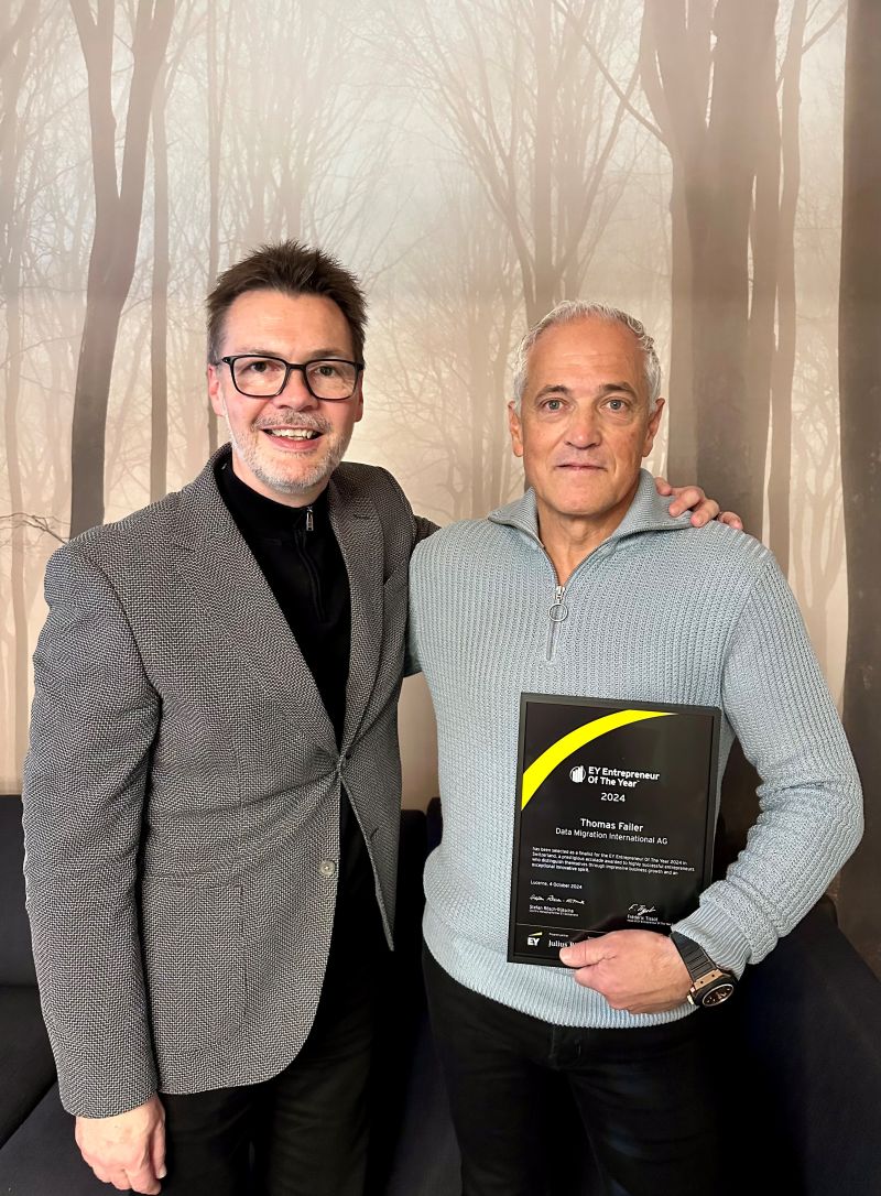 Thomas Failer holding the EY Entrepreneur Of The Year 2024 plaque